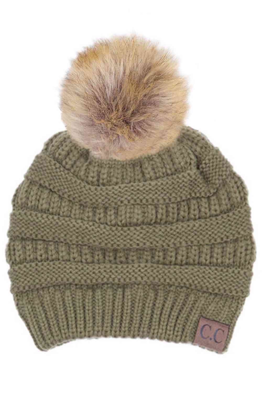 New Sage Stay warm and cozy with this classic C.C Pom Pom Knit Beanie, crafted from 100% soft acrylic for all-day comfort. The ribbed knit design adds texture and durability, while the signature pom pom on top brings a playful touch to any winter outfit. One size fits most, making it the perfect accessory for everyone. Ideal for cold weather adventures or casual everyday wear.