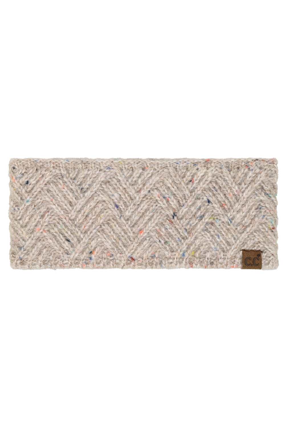Oatmeal Stay warm and stylish with this C.C Criss Cross Confetti Headwrap Winter Headband. Crafted from a premium blend of 66% recycled polyester, 24% acrylic, 5% wool, and 5% nylon, this headwrap offers cozy comfort while supporting sustainable fashion. The eye-catching criss cross confetti pattern adds a playful touch to any winter outfit. One size fits most, making it an easy grab-and-go accessory for chilly days.