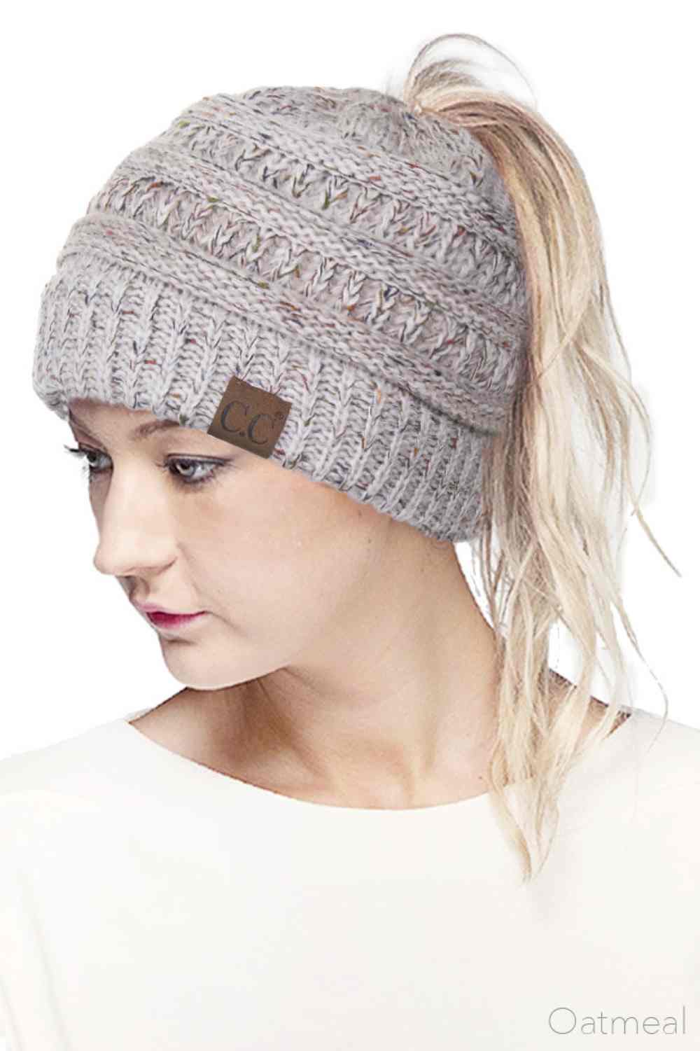 Oatmeal Stay cozy and stylish with the C.C Ombre Confetti Messy Bun Ponytail Beanie. Crafted from 100% acrylic, this versatile beanie features a trendy messy bun opening that lets you wear your hair down while staying warm. The soft, stretchy fabric provides all-day comfort and durability, making it perfect for casual outings or outdoor adventures.&nbsp;