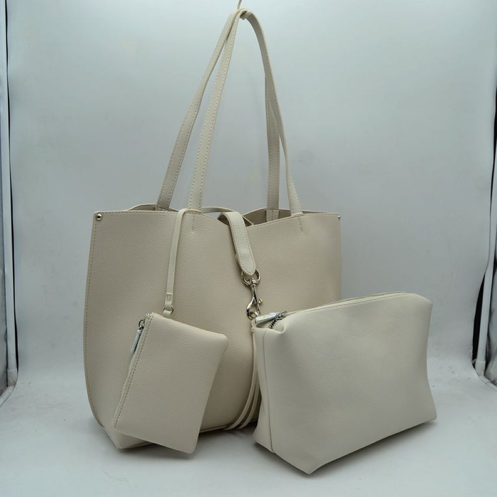 Off-White Simplify your daily schedule with this ultra-functional three-piece handbag set, offering unmatched organization in a sleek, minimalist package. Crafted from durable pebble-textured material that maintains a polished finish through daily wear, the oversized main tote features a timeless flared silhouette, a secure dog-leash clasp closure, and extra-long shoulder straps designed to sit comfortably on your shoulder.
