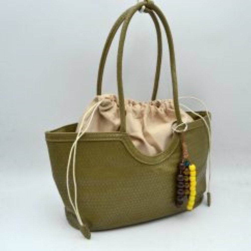Olive This stylish tote bag features an intricate woven exterior design in classic black, with a unique scoop-top silhouette that adds modern flair to a timeless style. The spacious interior is fitted with a contrasting cream-colored drawstring fabric lining that extends slightly above the rim, offering a secure closure and easy access to your daily essentials. Designed with long, rounded woven double shoulder straps for a comfortable carry