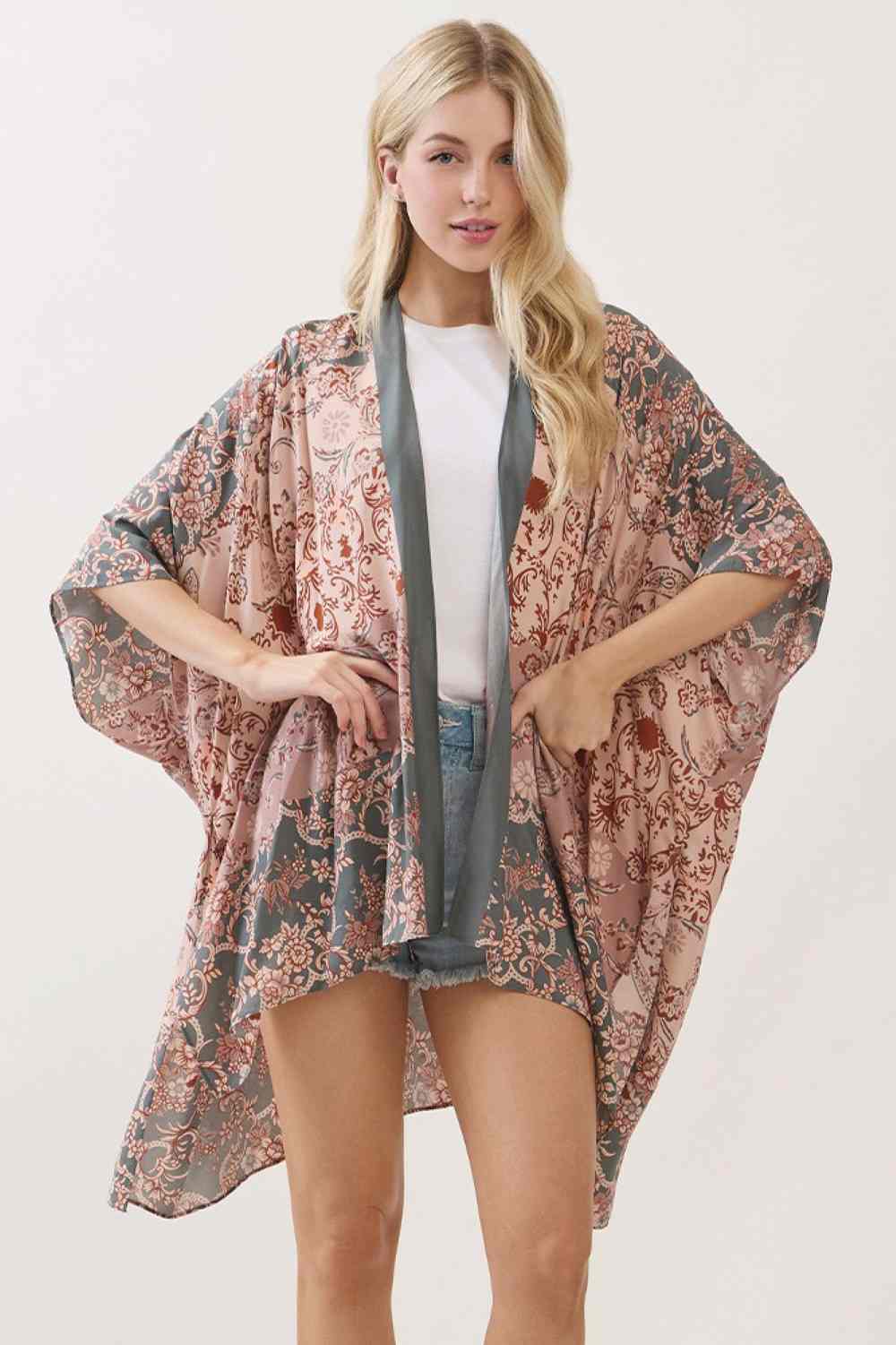 Olive Embrace effortless elegance with this bohemian kimono cover up, featuring a captivating floral paisley print that brings artistic flair to any outfit. Crafted from 100% viscose, the fabric drapes beautifully while offering a soft, breathable feel perfect for layering over swimwear or casual wear. Measuring 40" x 60", it provides generous coverage and versatile styling options. Whether you're heading to the beach, poolside, or looking for a lightweight layer for warm weather, this piece combines comfor