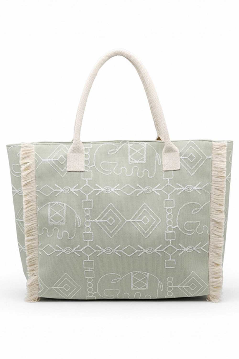 Olive Carry your essentials in bohemian style with this eye-catching tote bag. Featuring a vibrant geometric and elephant print design accented with playful fringe detailing, it's the perfect accessory for everyday adventures or weekend getaways. Crafted from durable 100% polyester, this spacious tote measures 21" x 14.25" x 5" and includes a secure zipper closure to keep your belongings safe. An inner pocket provides convenient organization for smaller items. Whether you're heading to the market, beach, or