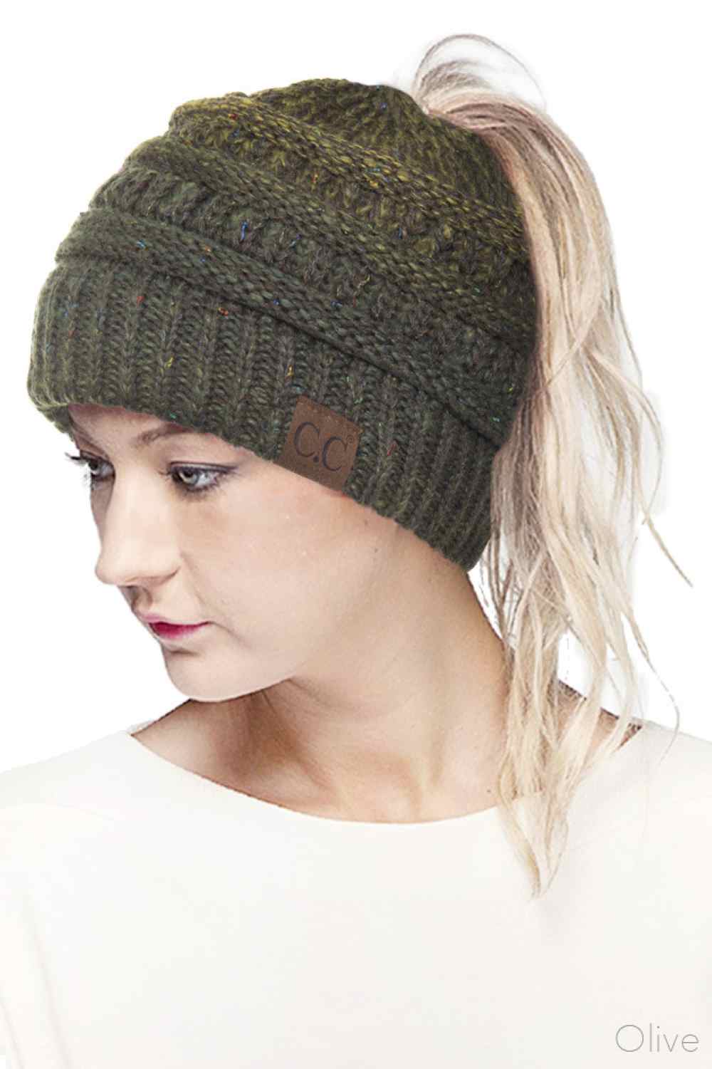 Olive Stay cozy and stylish with the C.C Ombre Confetti Messy Bun Ponytail Beanie. Crafted from 100% acrylic, this versatile beanie features a trendy messy bun opening that lets you wear your hair down while staying warm. The soft, stretchy fabric provides all-day comfort and durability, making it perfect for casual outings or outdoor adventures.&nbsp;