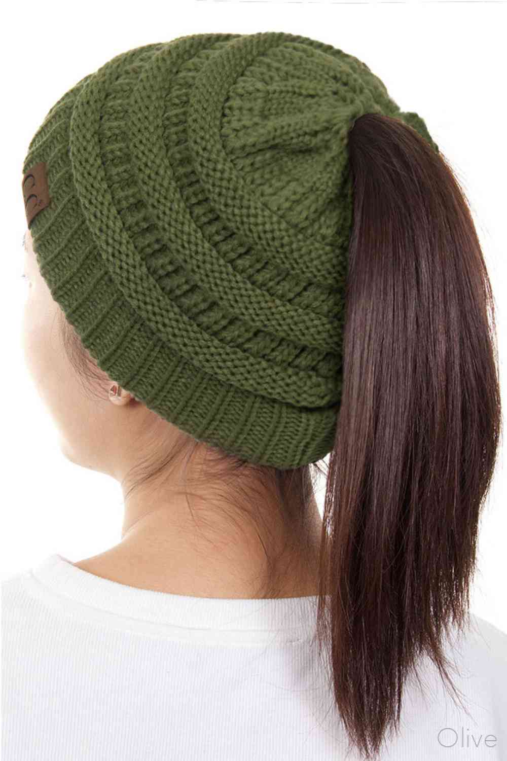 Olive The C.C Solid Color Ponytail Messy Bun Beanie combines comfort with versatility for effortless everyday style. Crafted from 100% soft acrylic, this beanie features an open crown design that accommodates ponytails and messy buns while keeping you warm. The one-size-fits-most construction ensures a secure, flattering fit for virtually anyone. Perfect for casual outings, workouts, or relaxed weekends, this practical accessory transitions seamlessly from season to season.