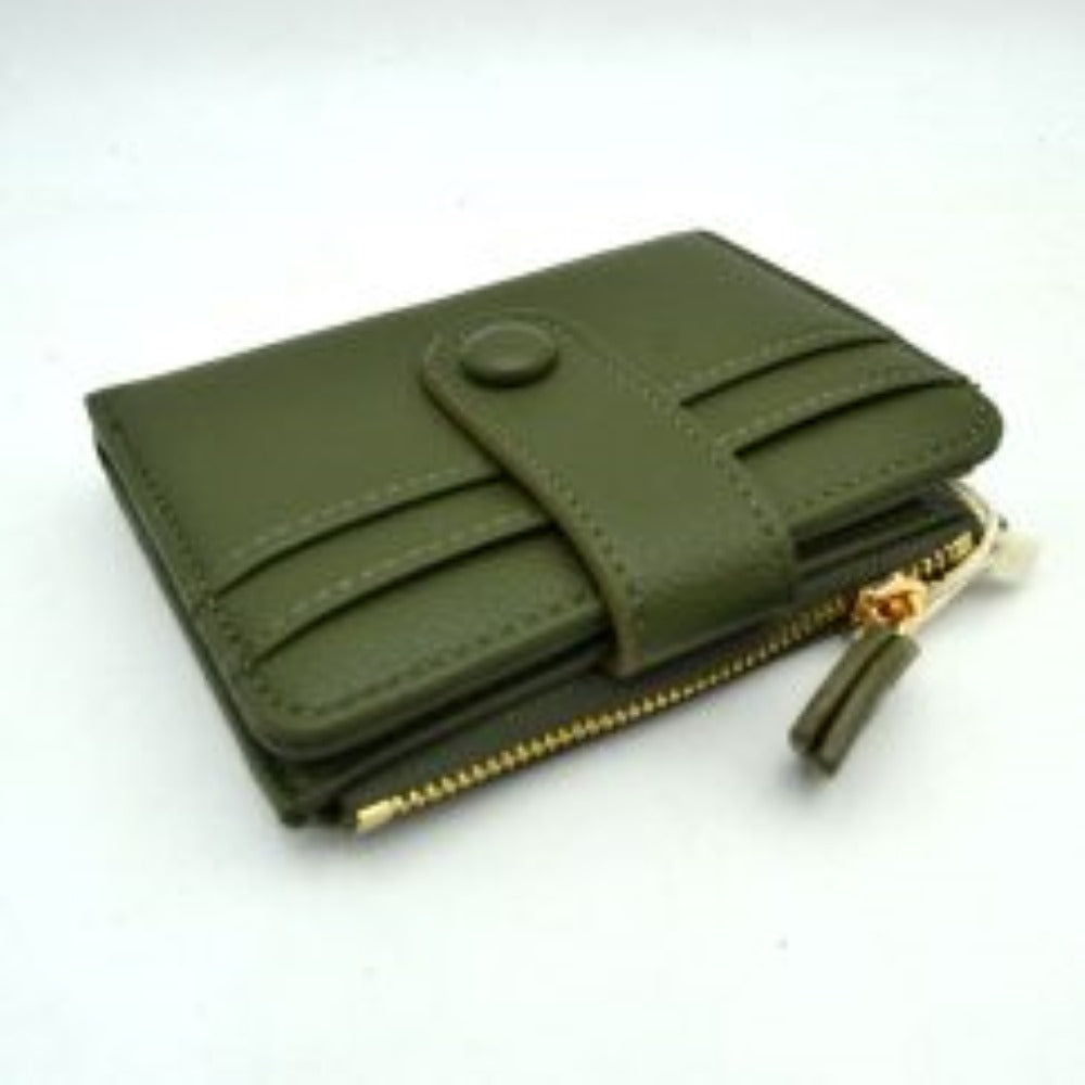 Olive This compact card holder wallet features a textured pebbled exterior in a soft beige tone, providing a sleek and practical design for daily organization. The front panel is equipped with multiple exterior card slots secured by a matching leather strap with a snap button closure. A secure side pocket with a metallic gold-tone zipper and a detailed leather pull tab opens to an internal compartment for coins or folded bills, making it an essential companion for minimalist carrying.
