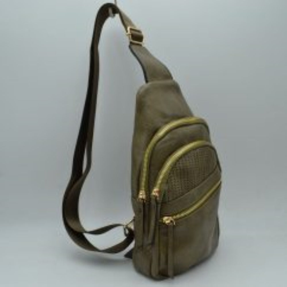 Olive This versatile sling bag features an asymmetric silhouette decorated with an arched, perforated pattern on the front panel, making it suitable for everyday use. It offers multiple organized storage compartments, including a main curved section, a mid-sized front zippered pouch, and a smaller diagonal zippered pocket near the base, all equipped with elongated pull tabs. Designed for convenience, the bag is completed with a single wide