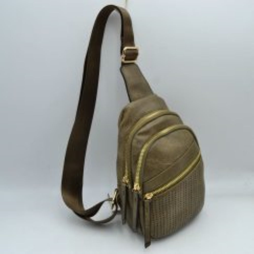 Olive This functional sling bag features a textured, grained finish with a multi-tiered silhouette engineered for organized everyday use. It provides multiple distinct storage compartments, including a primary curved main section, an intermediate arched pouch, and a lower pocket featuring a horizontal zipper closure and a decorative perforated design. The bag is completed by a single wide