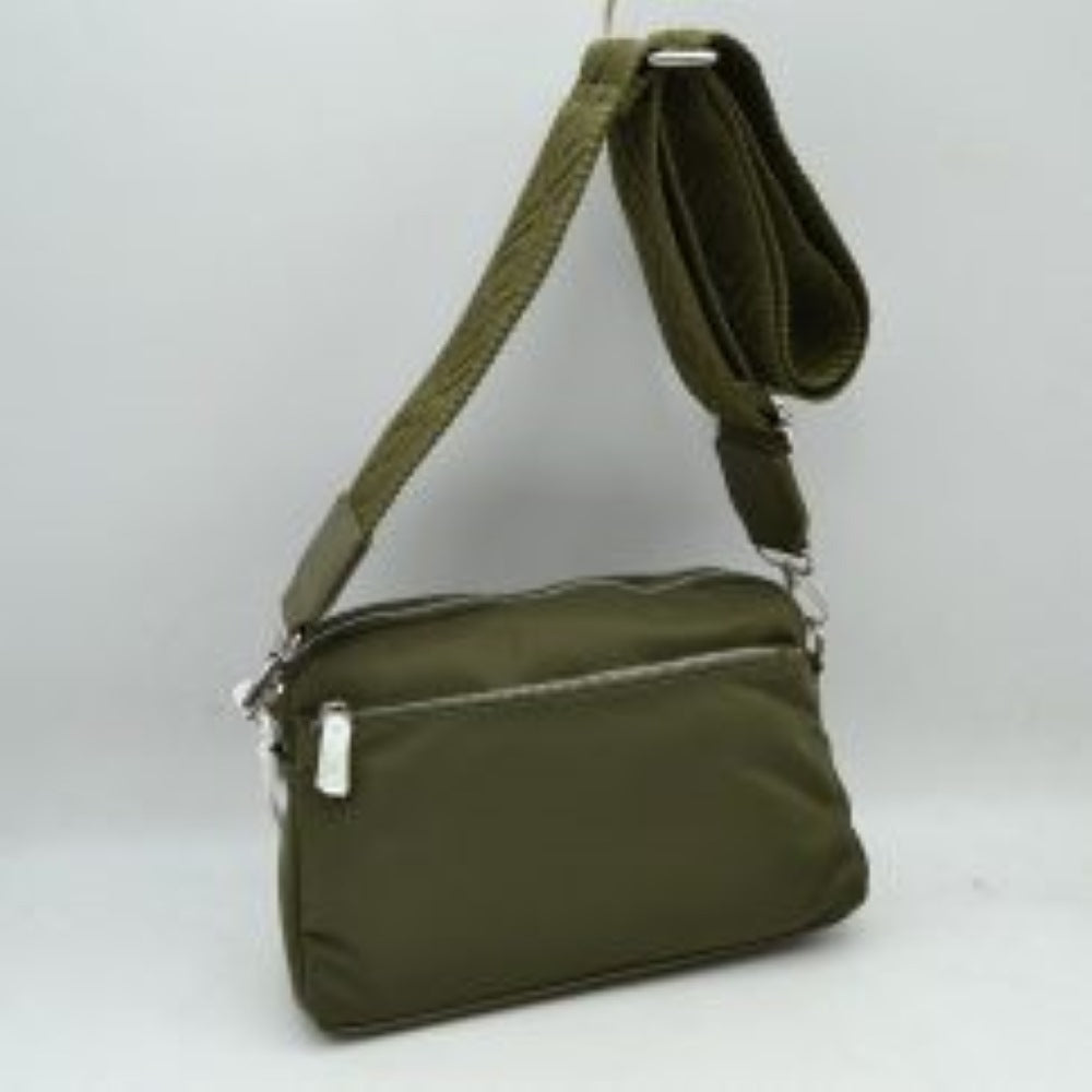 Olive This functional crossbody bag features a smooth, durable nylon exterior in a warm brown tone, making it a practical and versatile choice for organized daily use. Designed with multiple zippered compartments, it includes a convenient front horizontal zipper pocket for quick access to smaller essentials alongside secure main top-zippered sections. The bag is finished with silver-tone hardware and a wide, adjustable shoulder strap featuring a textured pattern for a stylish and comfortable