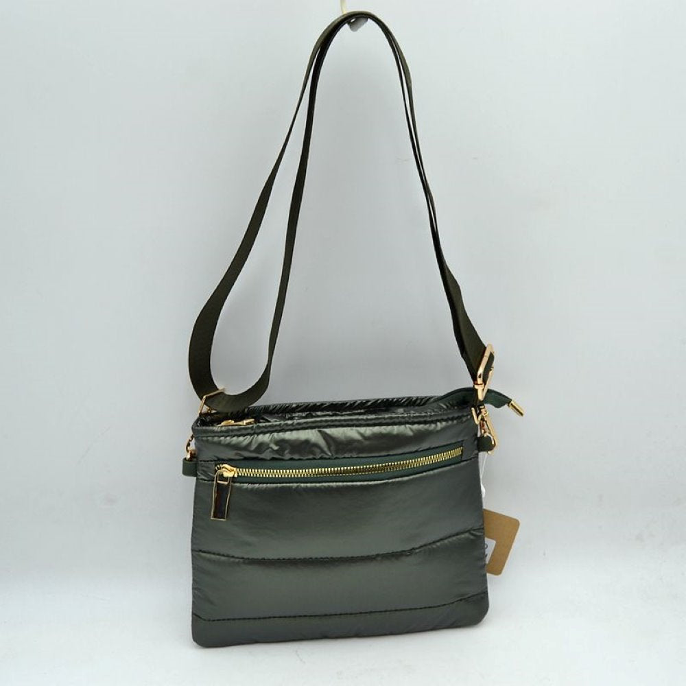 Olive Stay organized in style with the sporty, lightweight crossbody bag. Combining a trendy puffer design with everyday functionality, this low-profile pouch is perfect for travel, running errands, or keeping your hands free on the go.