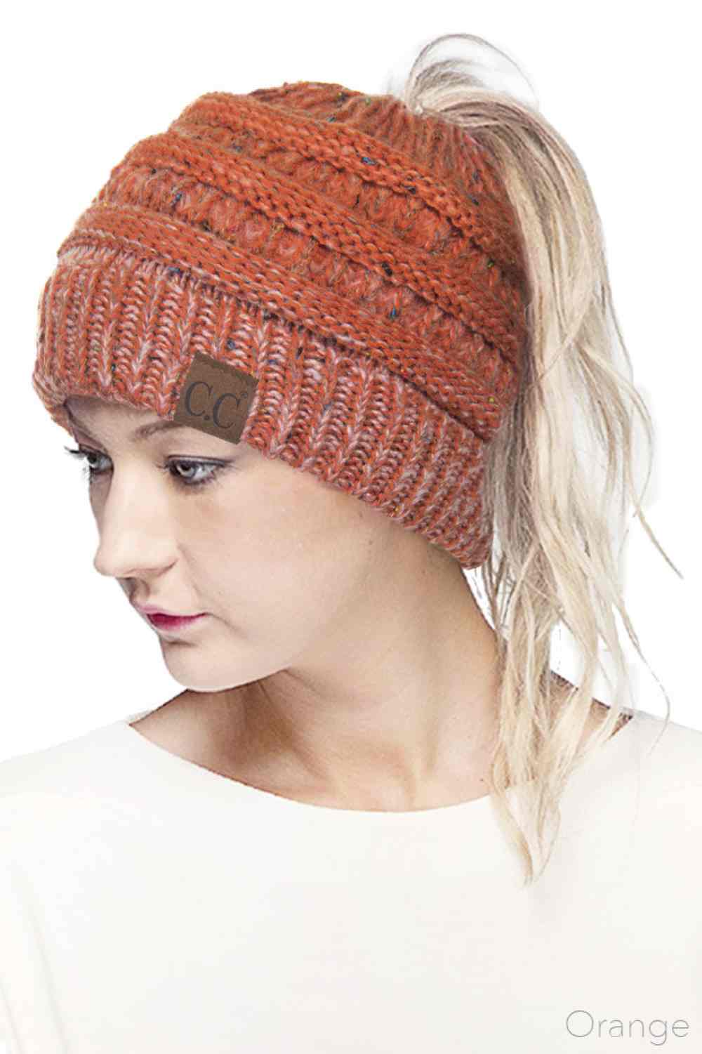 Orange Stay cozy and stylish with the C.C Ombre Confetti Messy Bun Ponytail Beanie. Crafted from 100% acrylic, this versatile beanie features a trendy messy bun opening that lets you wear your hair down while staying warm. The soft, stretchy fabric provides all-day comfort and durability, making it perfect for casual outings or outdoor adventures.&nbsp;