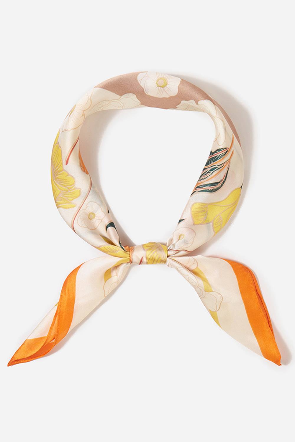 Orange Brighten your summer style with this charming floral pattern blocks bandana scarf. Crafted from lightweight 100% polyester, it's perfect for warm weather wear tie it around your neck, head, or wrist for effortless versatility. The generous 27.5" x 27.5" square cut offers plenty of styling options. Whether you're heading to the beach, running errands, or adding a pop of color to any outfit, this easy-care scarf keeps you cool and fashionable all season long.