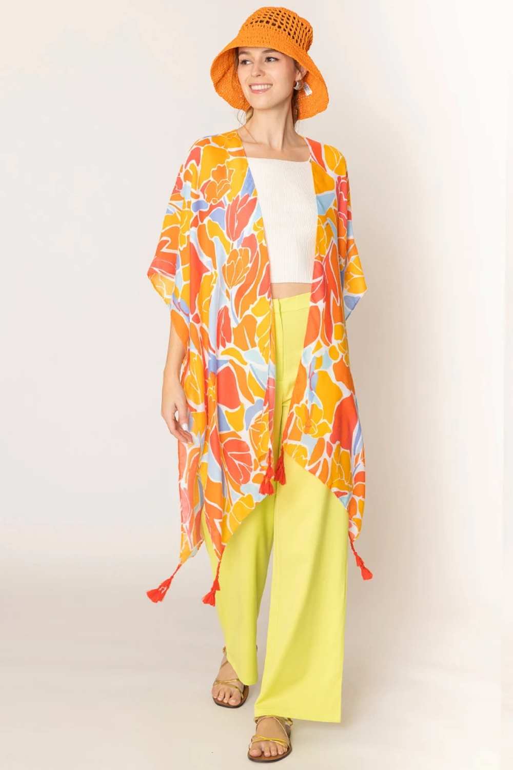Orange Embrace effortless elegance with this stunning Floral Print Tassel Kimono. Crafted from lightweight 100% polyester, this versatile piece features a beautiful floral design and charming tassel details that add movement and dimension. With generous dimensions of 35.4" x 35.4", it drapes beautifully over any outfit, perfect for layering during warmer months or as a beach cover-up.