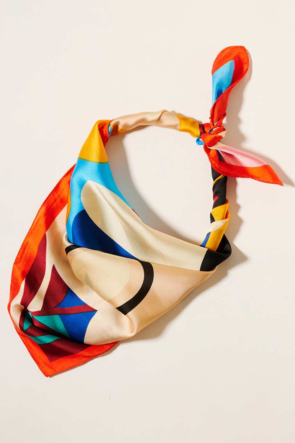 Orange Elevate your accessory game with this charming square silky scarf featuring a playful flower print. Crafted from 100% polyester, it drapes beautifully and feels luxuriously smooth against your skin. The perfect 27.5" x 27.5" size works as a neck scarf, headwrap, or styling accent for any outfit. Whether you're adding a pop of color to your everyday look or dressing up for a special occasion, this versatile piece brings effortless elegance and personality to your wardrobe.
