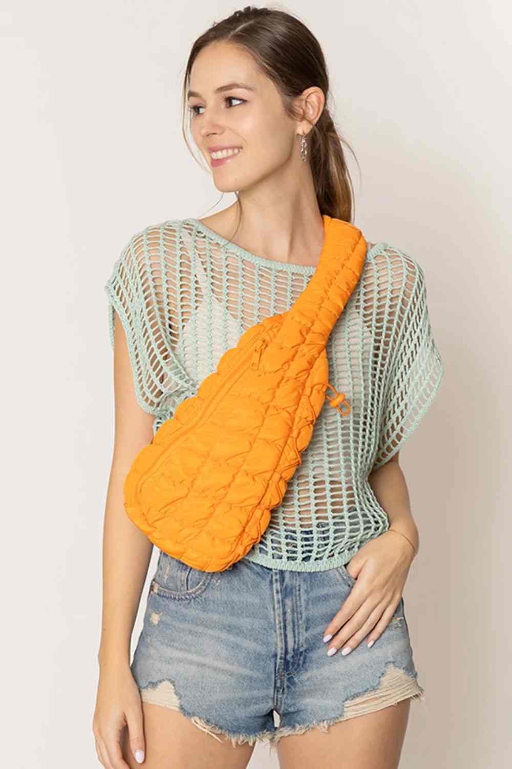 Orange  Carry your essentials in style with this Solid Quilted Sling Bag. Crafted from durable 100% polyester with a classic quilted design, it offers a sleek, versatile look that complements any outfit. The adjustable sling strap allows for comfortable crossbody wear, making it perfect for everyday errands, travel, or casual outings. One size fits all