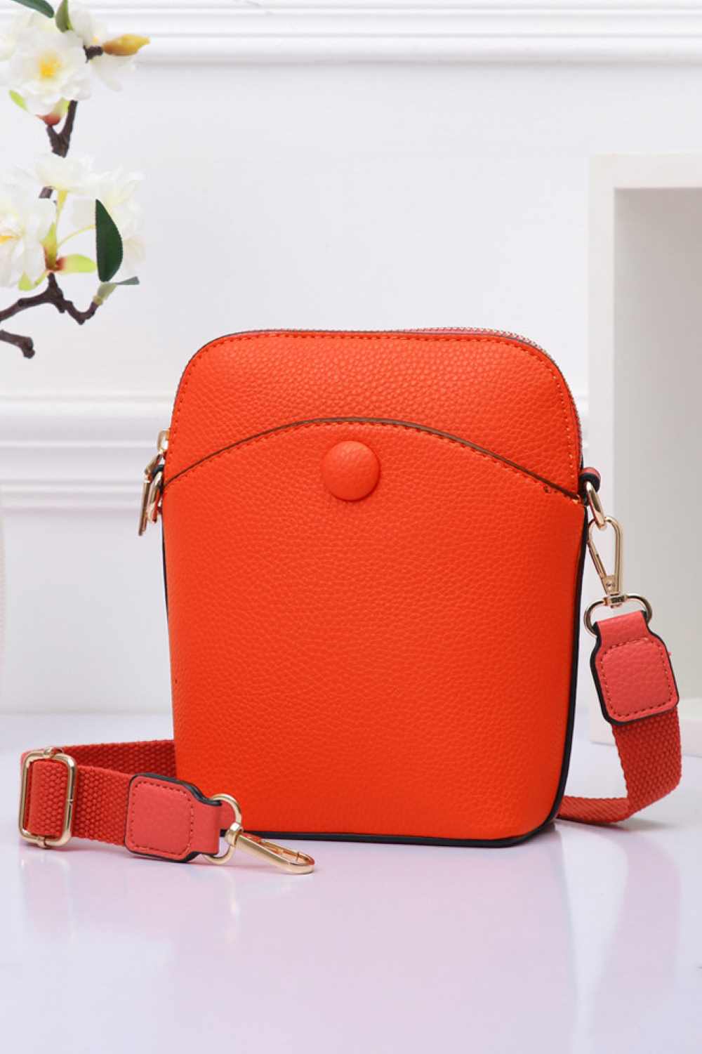 Orange Solid PU Mini Crossbody Bag combines durability with a sleek design, crafted from high-quality polyurethane for a lightweight yet sturdy feel. Its compact size offers convenient hands-free carrying, ideal for daily essentials. The adjustable strap ensures a customized fit, making it perfect for on-the-go use without compromising style or functionality.