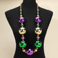 Multi, Purple Oversized statement beaded necklace featuring bold round accents arranged for dramatic impact and playful movement. Designed to stand out at parties, themed events, parades, and celebrations, this necklace elevates simple outfits with eye-catching style while remaining lightweight and easy to wear.