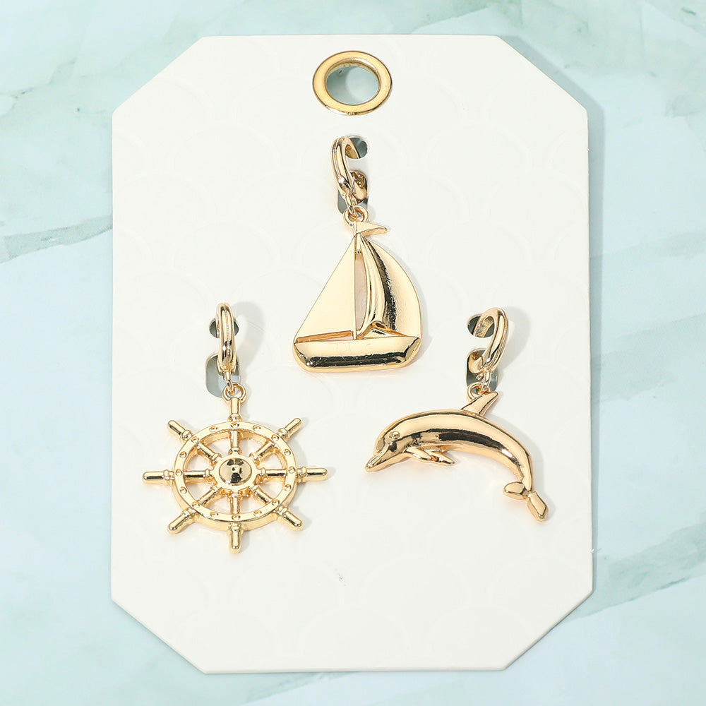 Madeline Love Gold 3PCS - Metal Ship Wheel Sailboat Dolphin Pendant Charm Set - Bags & Wallets