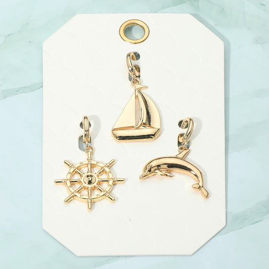 Madeline Love Gold 3PCS - Metal Ship Wheel Sailboat Dolphin Pendant Charm Set - Bags & Wallets
