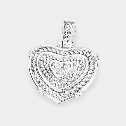 Silver Stone Embellished Metal Heart Pendant adds a touch of elegance to any outfit. With its stunning design and expertly crafted materials, this pendant is sure to become a staple in your jewelry collection. The stone embellishments add a touch of sparkle, making it perfect for any occasion.