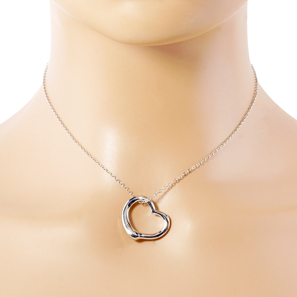 Silver Metal Heart Cut-Out Pendant Necklace showcases a modern cut-out design, adding a touch of elegance to any outfit. Made with high-quality materials, this necklace is both durable and stylish. Elevate your look with this versatile accessory that perfectly blends beauty and functionality. 