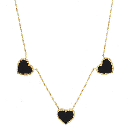 Black Gold Dipped Triple Heart Pendant Necklace adds a touch of romance to any outfit. Crafted with quality and precision, each heart is dipped in genuine gold for a luxurious finish. This necklace is a stunning addition to any jewelry collection, perfect for special occasions or everyday wear.