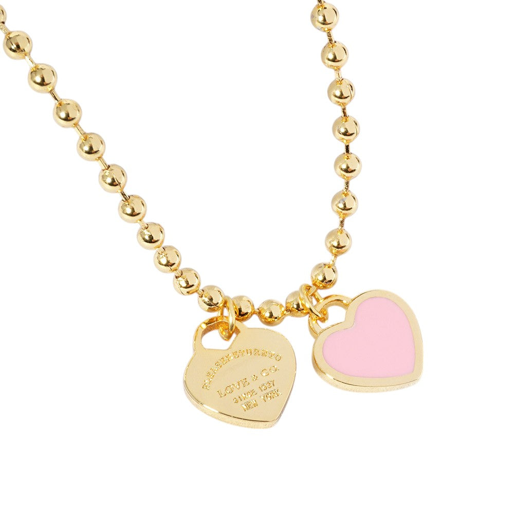 Gold Dipped Double Heart Pendant Bubble Chain Necklace is a stunning addition to any jewelry collection. Made from high quality materials, this necklace features a unique design that combines elegance with modern style. The gold dipping process ensures a durable and lasting finish. A perfect gift for any occasion.