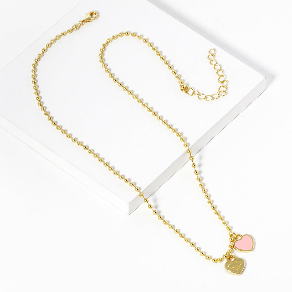 Gold Dipped Double Heart Pendant Bubble Chain Necklace is a stunning addition to any jewelry collection. Made from high quality materials, this necklace features a unique design that combines elegance with modern style. The gold dipping process ensures a durable and lasting finish. A perfect gift for any occasion.