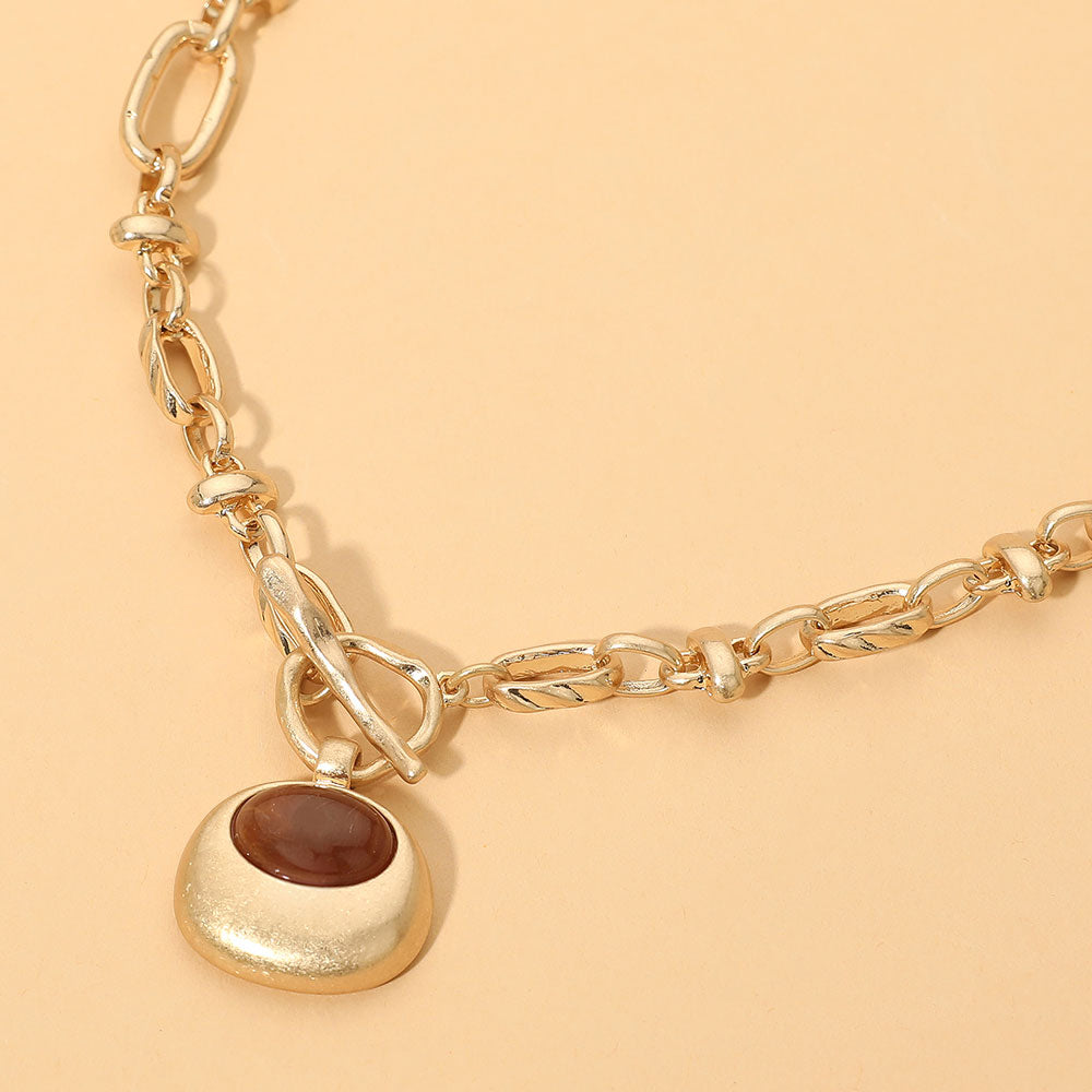 Madeline Love Brown, Worn Gold Chunky Pendant Accent Toggle Necklace