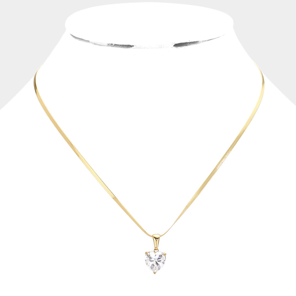 18K Gold Dipped Stainless Steel CZ Heart Pendant Necklace, a perfect way to add a luxurious touch to any outfit. Crafted from stainless steel in 18K gold plating, it features a sparkling cubic zirconia heart pendant. Durable and long-lasting, it's sure to make a statement. Perfect gift for Valentine's or any other day