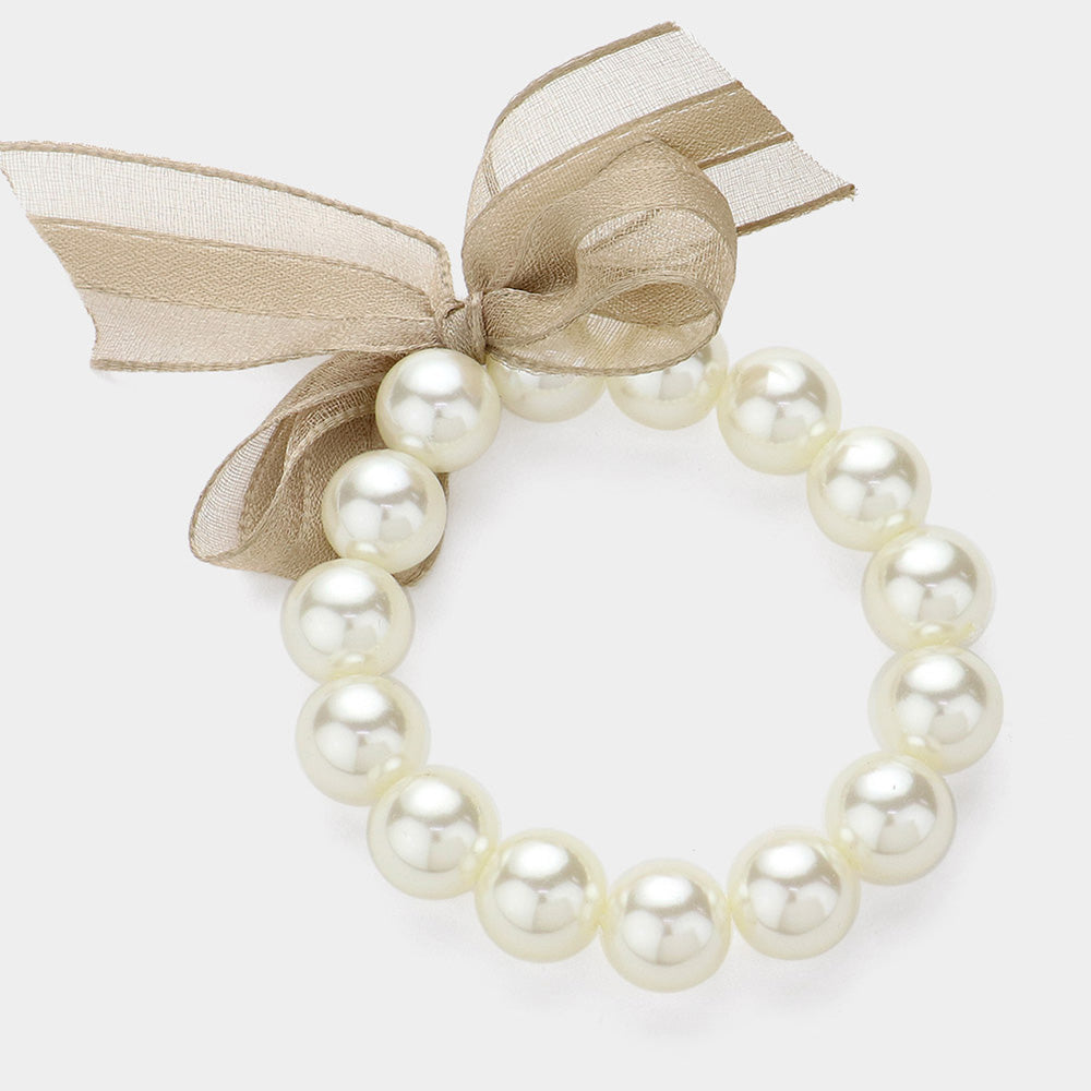 Madeline Love Beige, Cream Bow Pointed Pearl Stretch Bracelet - Bracelets