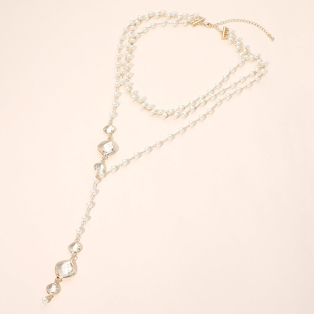 Madeline Love Cream, Gold Faceted Clear Charm Drop Pearl Beaded Lariat Necklace
