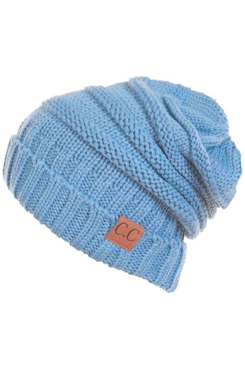 Pale BLue Wrap yourself in warmth with this C.C Slouchy Knitted Beanie, crafted from 100% soft acrylic for ultimate comfort. The oversized silhouette and plush pom pom detail create a relaxed, on-trend look perfect for chilly days. Available in nine versatile colors—Beige, Berry, Dark Denim, Heather Gray, Ivory, Pistachio, Rose, Steel Blue, and Violet Purple—this beanie pairs effortlessly with any winter wardrobe. The ribbed knit construction ensures durability and a flattering fit.
