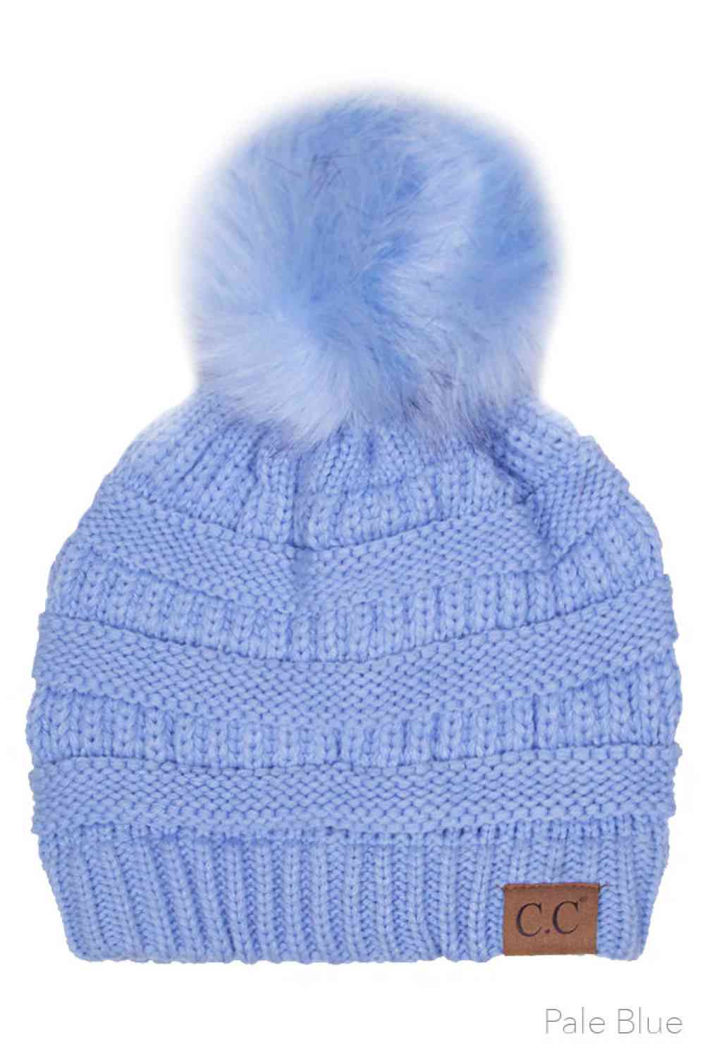 Pale Blue Elevate your winter wardrobe with this classic C.C knitted beanie, crafted from 100% soft acrylic for exceptional warmth and comfort. The signature fur pom pom adds a touch of sophistication, while the one-size-fits-most design ensures a flattering fit for virtually anyone. Perfect for layering during cold months, this versatile beanie transitions seamlessly from casual outings to outdoor adventures. The premium acrylic blend resists pilling and maintains its shape season after season, making it a