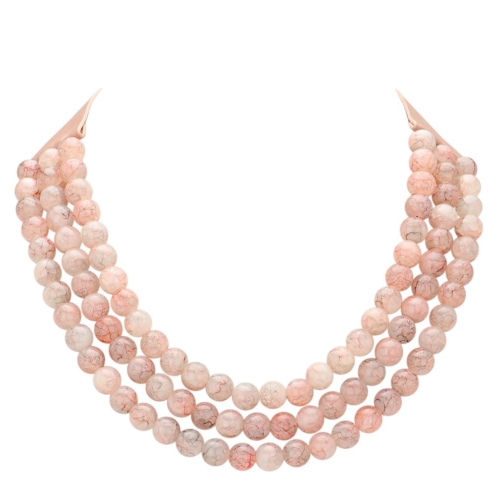 Peach Chunky Metal Ball Beaded Triple Layered Faux Leather Magnetic Necklace is perfect for adding a touch of style and sophistication to any outfit. With its triple layered design and magnetic closure, it is not only fashionable but also easy to wear. The chunky metal ball beads add a unique touch to this faux leather necklace, making it a must-have accessory for any fashion-forward individual.