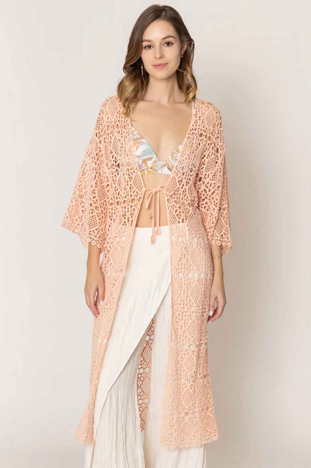 Peach Effortless layering meets timeless style with this Solid Crochet Cardigan. Crafted from 100% cotton, it offers breathable comfort perfect for any season. The open-weave crochet design adds texture and visual interest while remaining lightweight and versatile. Pair it over dresses, tees, or tanks for an instantly polished look.