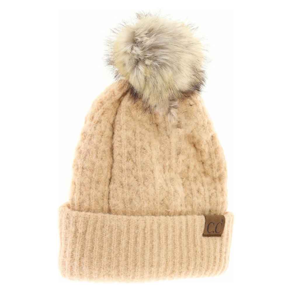 Peanut Solid Smocked Stitch Fur Pom C.C Beanie combines expert craftsmanship with functional winter style. Featuring a tightly smocked stitch pattern, this beanie ensures durability and a comfortable fit. The luxurious fur pom adds a refined accent, elevating this essential cold-weather accessory. Its design provides warmth without bulk, making it an excellent choice for outdoor activities or everyday wear during chilly seasons. 