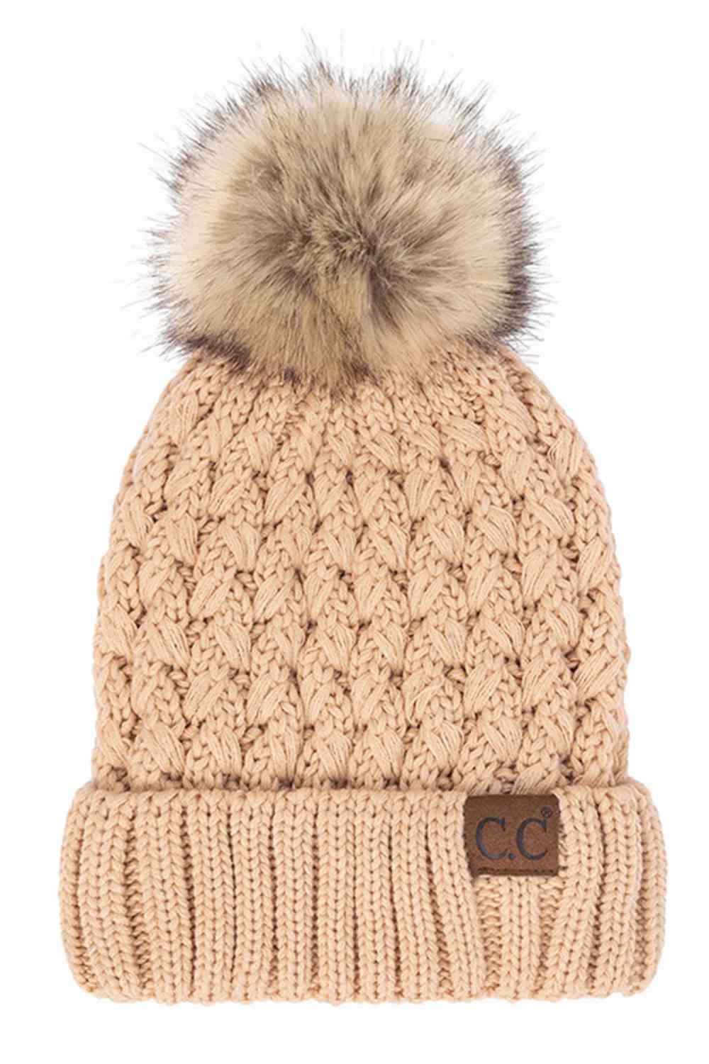 Beige Elevate your winter wardrobe with the C.C Lattice Crossover Stitch Beanie, featuring an intricate lattice pattern and cozy pom detail. Crafted from 100% soft acrylic, this beanie delivers warmth and comfort without the weight. The crossover stitch design adds visual interest while the relaxed fit suits most face shapes. Perfect for layering over your favorite winter looks, this versatile beanie transitions effortlessly from casual outings to outdoor adventures. One size fits most for easy, everyday we