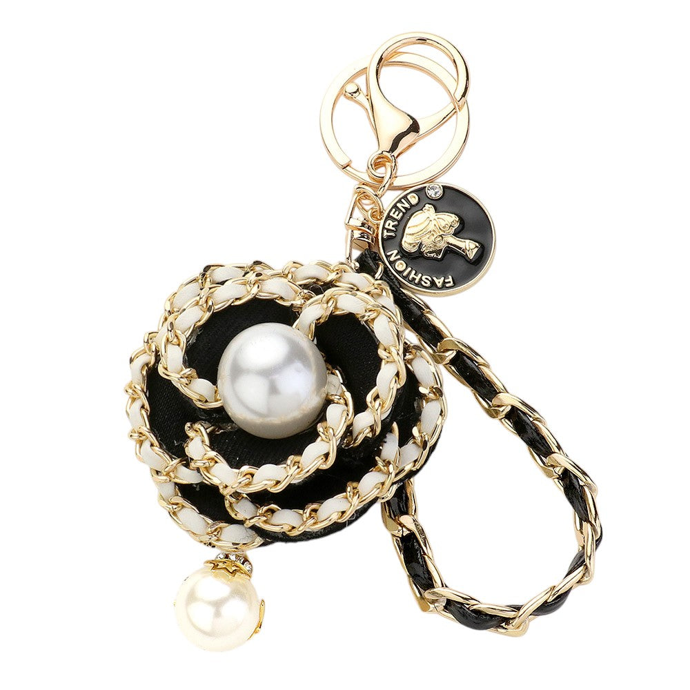Black Gold Pearl Pointed Faux Leather Braided Chain Deco Flower Key Chain is a stylish and practical addition to any keychain collection. The chain is crafted with faux leather and features a beautiful pearl and deco flower design. It is not only fashionable but also durable and easy to attach to your keys.