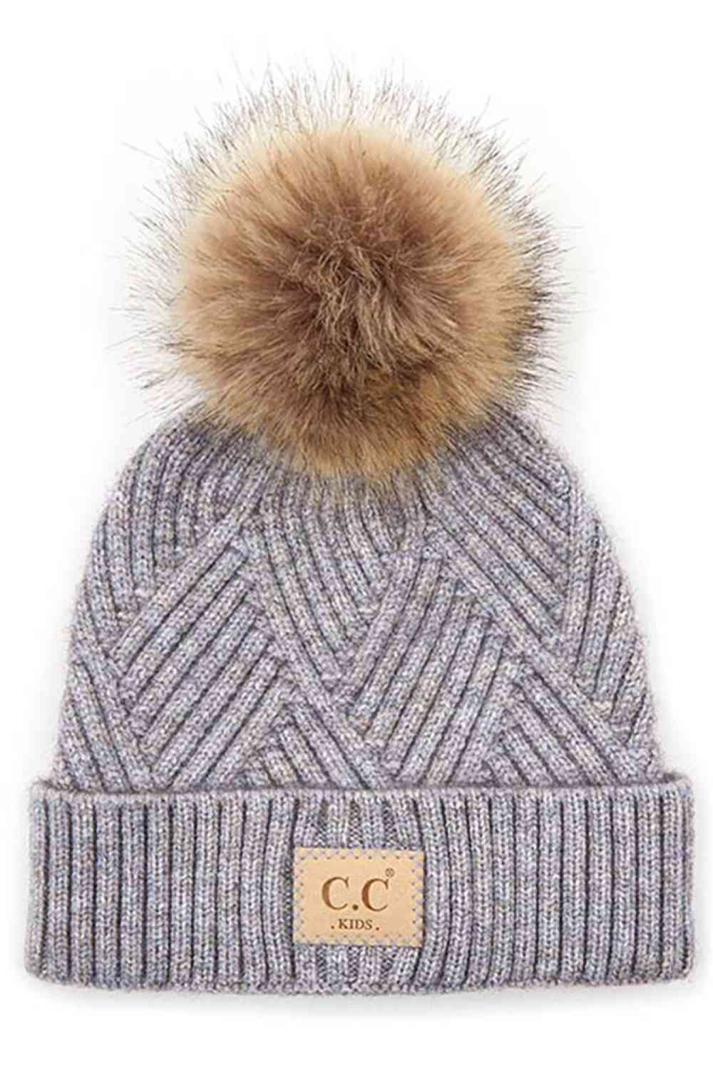 Periwinkle Keep your little one cozy with this C.C Kids Knit Beanie, featuring a playful diagonal stripes criss-cross pattern. Crafted from a soft blend of 47% rayon, 31% PBT, and 22% nylon, this beanie offers warmth and durability for everyday wear.