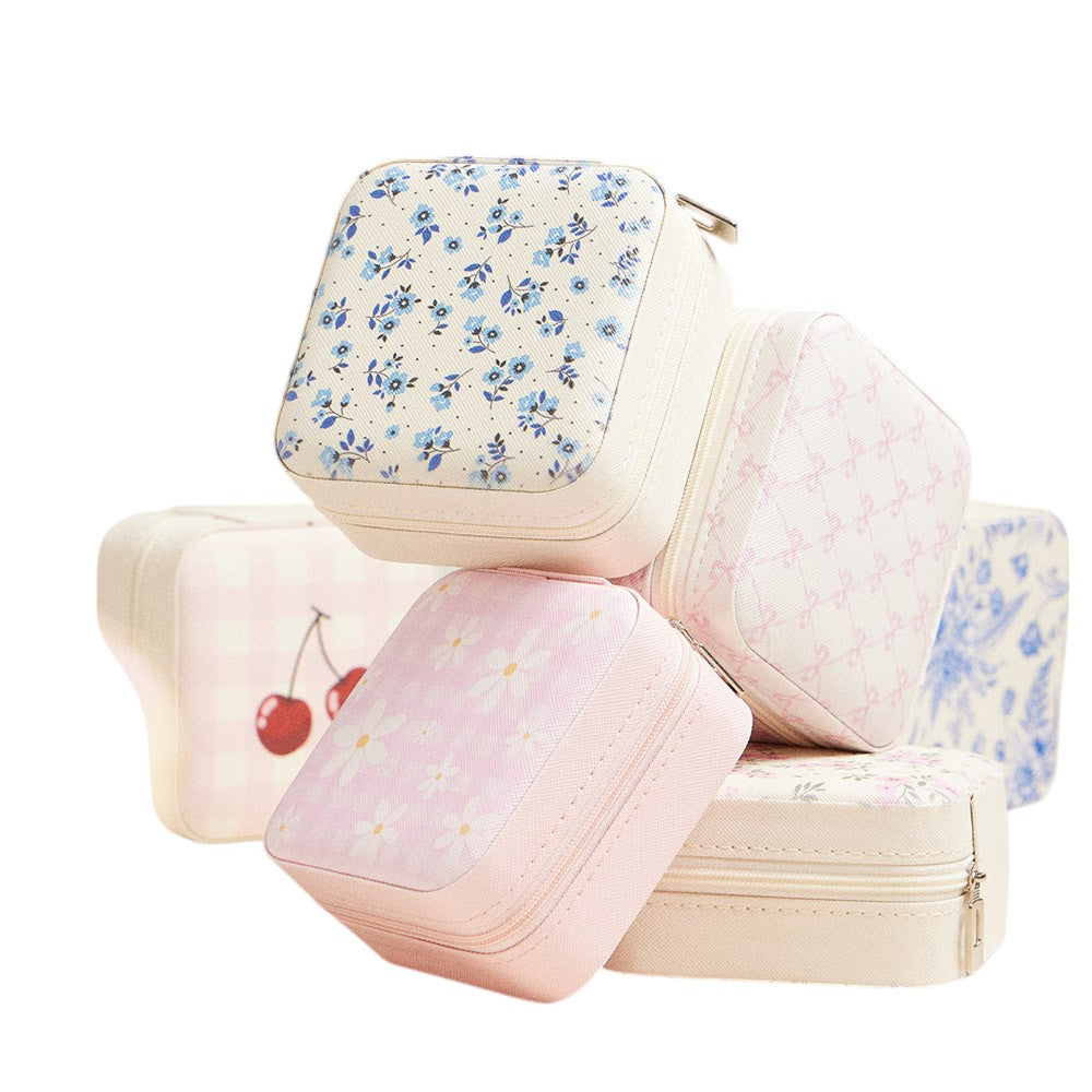 Pink Bow Pattern Portable Square Jewelry Box is perfect for storing and organising your precious jewellery. The elegant pink bow pattern adds a touch of style, making it a great addition to your dressing table or as a gift. Its compact size makes it ideal for travelling.