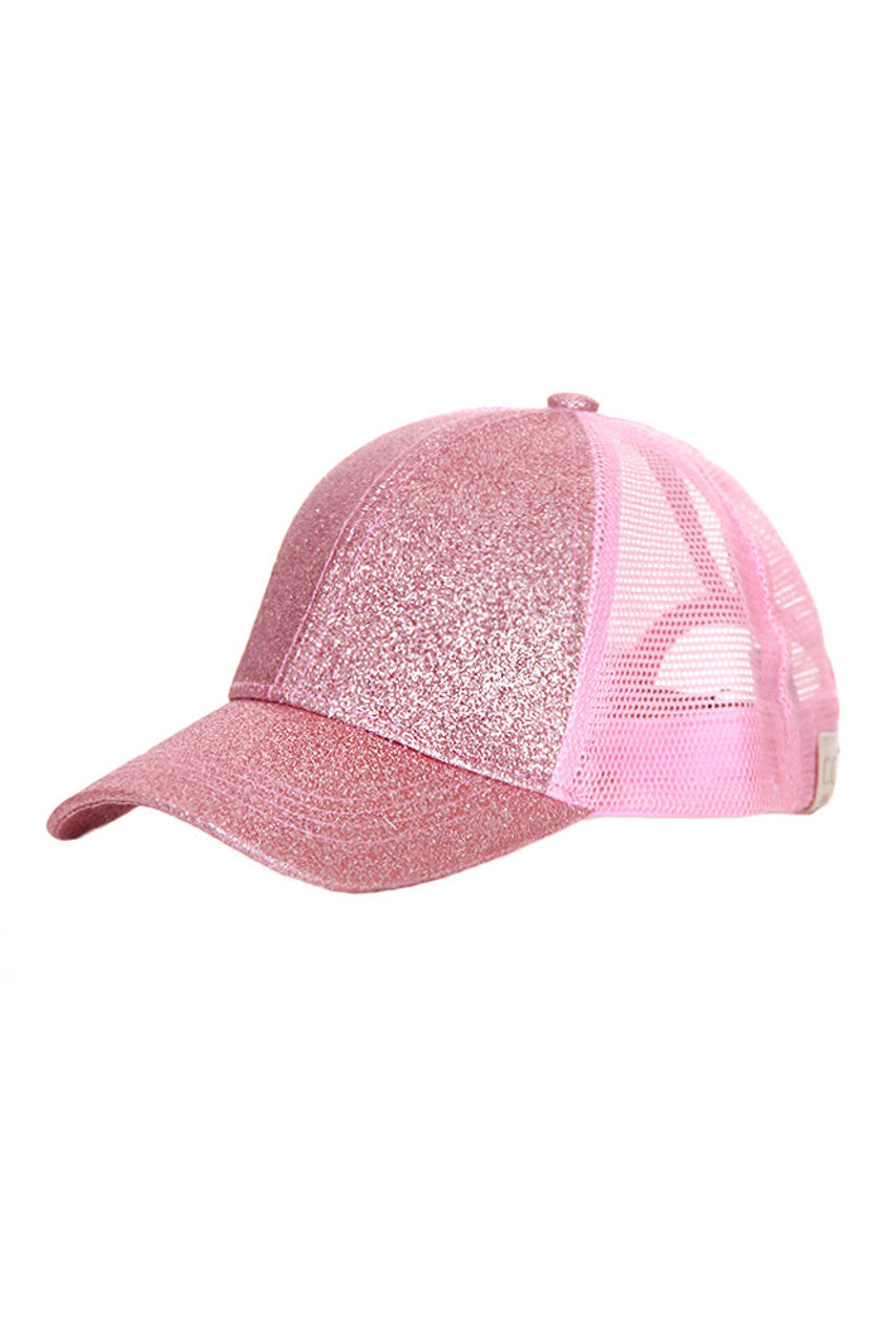 Pink C.C Baseball Ponycap combines classic baseball cap style with a convenient ponytail opening, offering both comfort and functionality. Crafted from breathable materials, it ensures all-day wearability while accommodating various hair types and styles. Ideal for active lifestyles, this cap provides sun protection without compromising on style or practicality. 