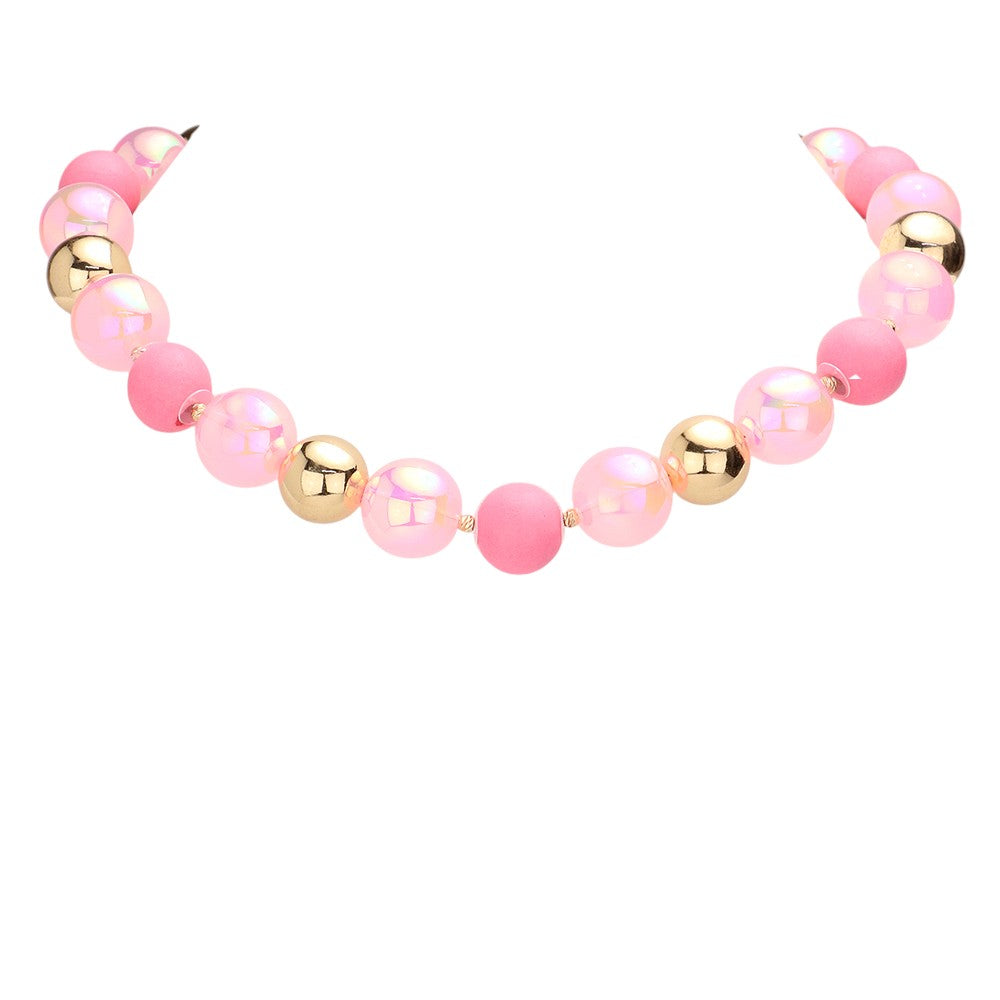Pink Chunky Glass Metal Ball Beaded Necklace is a stunning addition to any outfit. The chunky glass and metal balls provide a bold and eye-catching look, while the beaded design adds a touch of elegance. Made with high-quality materials, this necklace is both durable and stylish. Elevate your style with this statement piece.