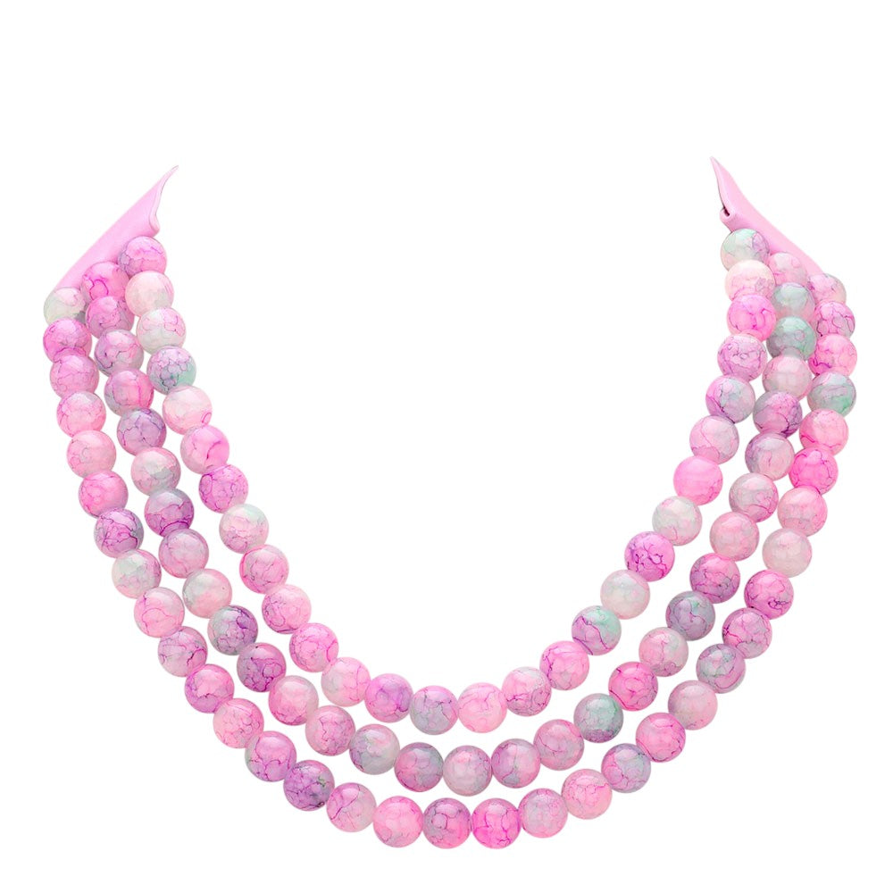 Pink Chunky Metal Ball Beaded Triple Layered Faux Leather Magnetic Necklace is perfect for adding a touch of style and sophistication to any outfit. With its triple layered design and magnetic closure, it is not only fashionable but also easy to wear. The chunky metal ball beads add a unique touch to this faux leather necklace, making it a must-have accessory for any fashion-forward individual.