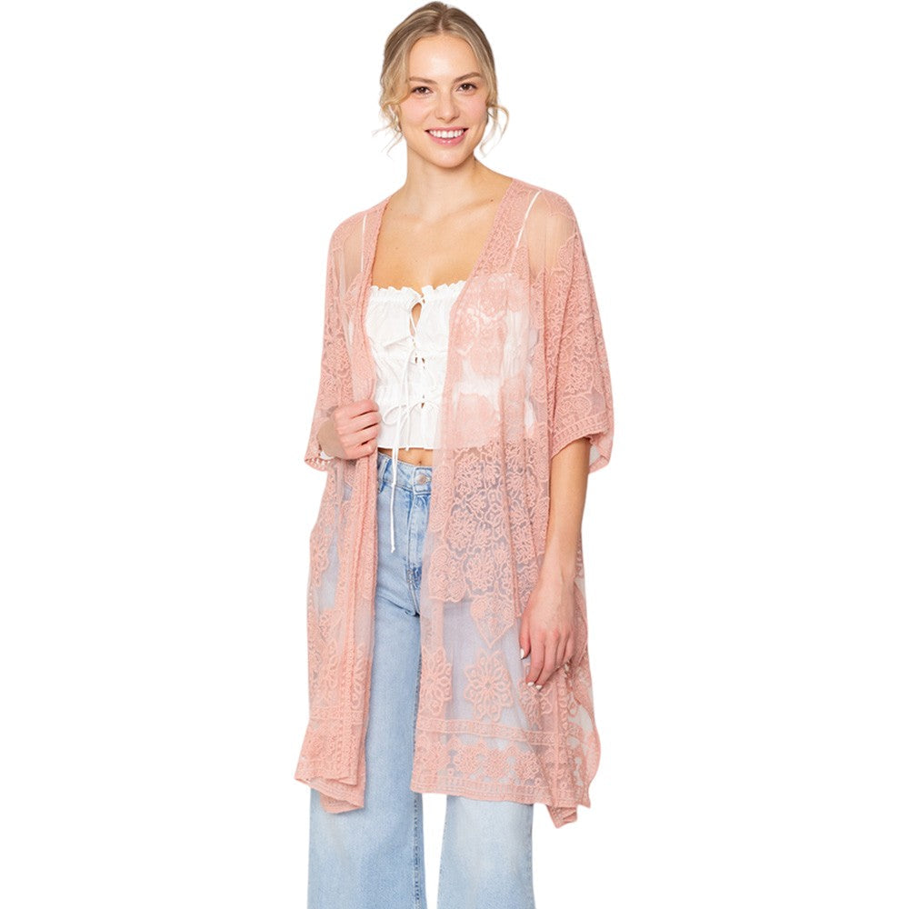 Pink Flower Lace Kimono Poncho is a versatile and fashionable addition to any wardrobe. The delicate lace detailing adds a touch of elegance, while the kimono style allows for comfortable and easy wear. Perfect for dressing up any outfit, this poncho is a must-have for any fashion-forward individual. 