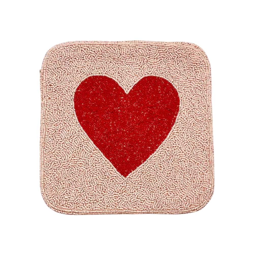 Pink Heart accented crossbody bag is adorned with delicate seed beads, adding a touch of elegance to any outfit. The compact square shape is perfect for carrying your essentials, while the crossbody strap keeps your hands free. The unique design and quality materials make it a must-have accessory for any fashion-forward individual.
