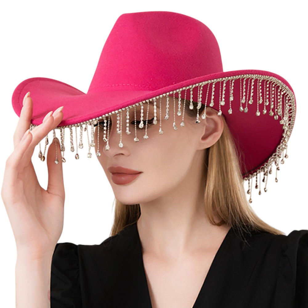 Pink Rhinestone Stone Paved Fringe Around Cowboy Western Hat features a unique and stylish design with rhinestone-studded fringe detailing. Constructed for durability and comfort, it adds a touch of glamour to any look. Perfect for a day on the ranch or a night out on the town, it is a must-have for any fashion-forward cowboy.