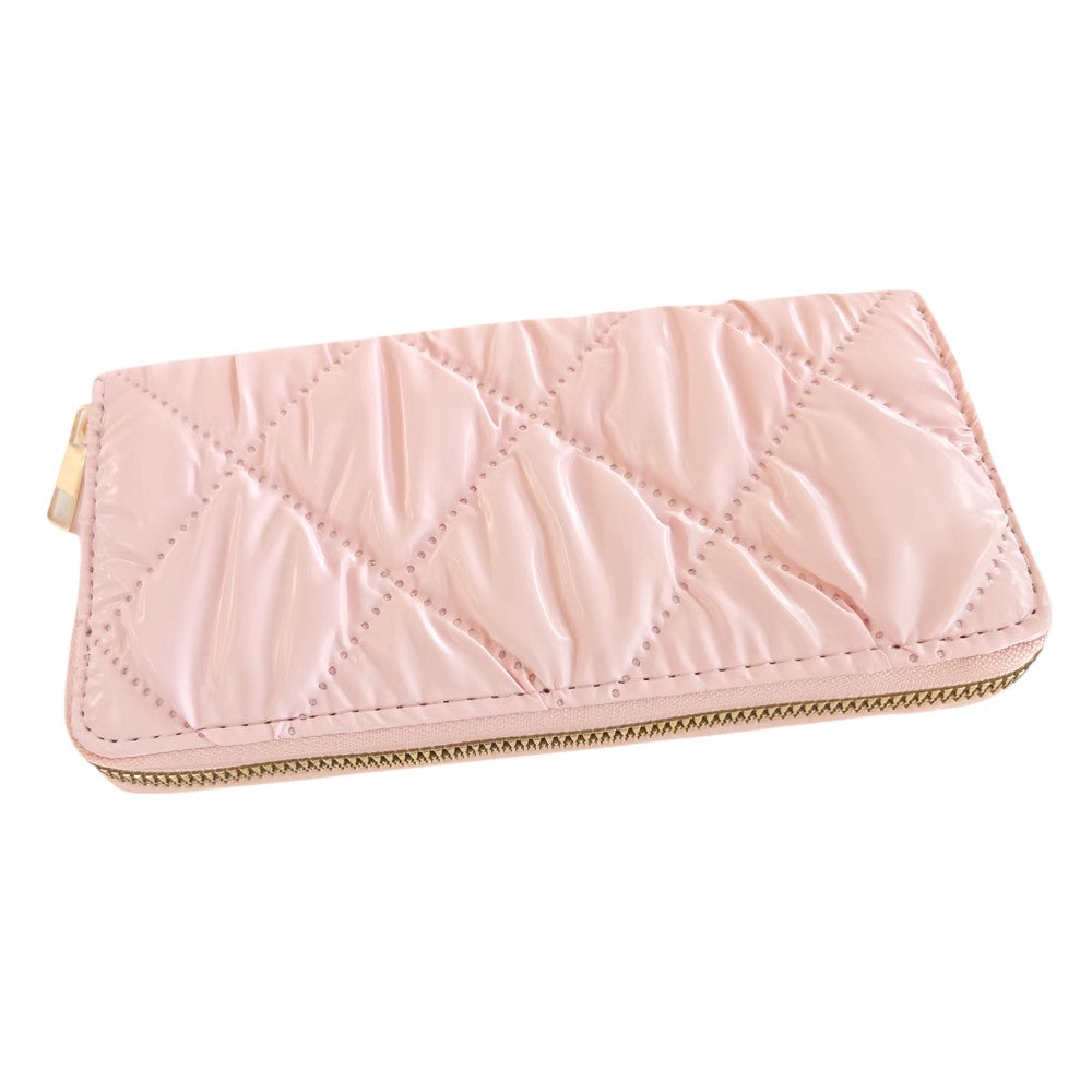 Pink Shiny Faux Leather Padded Wallet with Wristlet offers a sleek and stylish solution for storing your essentials. Its shiny faux leather material adds a touch of sophistication, while the padded design keeps your valuables safe. The attached wristlet also provides convenience and hands-free carrying. 