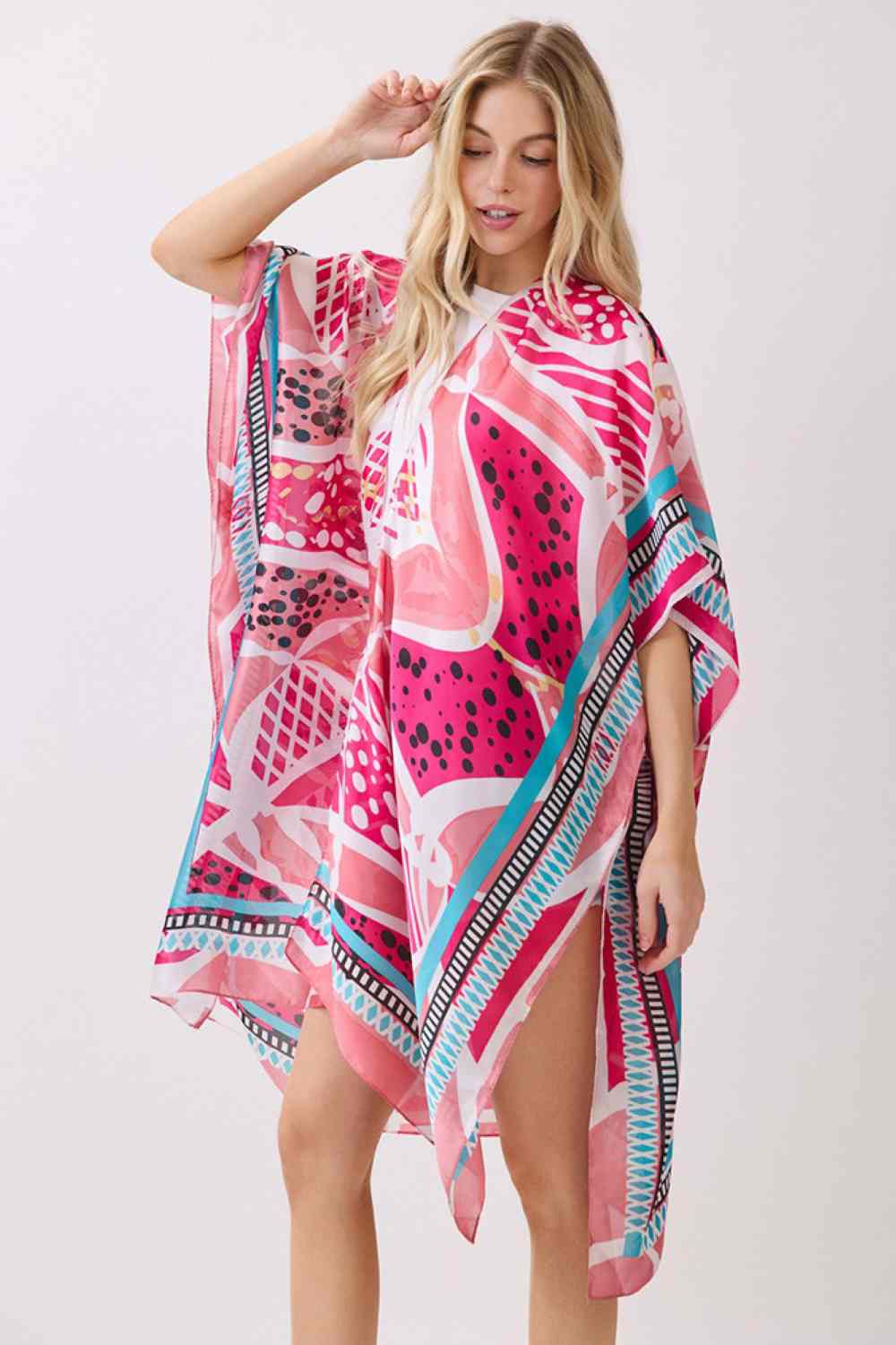 Pink Effortless elegance meets comfort in this abstract botanical kimono cover-up. Featuring a striking botanical print with decorative pattern edges, this lightweight piece drapes beautifully over any outfit. The silky polyester fabric feels luxurious against skin while maintaining easy care. Perfect for layering at the beach, poolside, or casual outings. Dimensions: 35" x 36". 100% polyester. Made in China.
