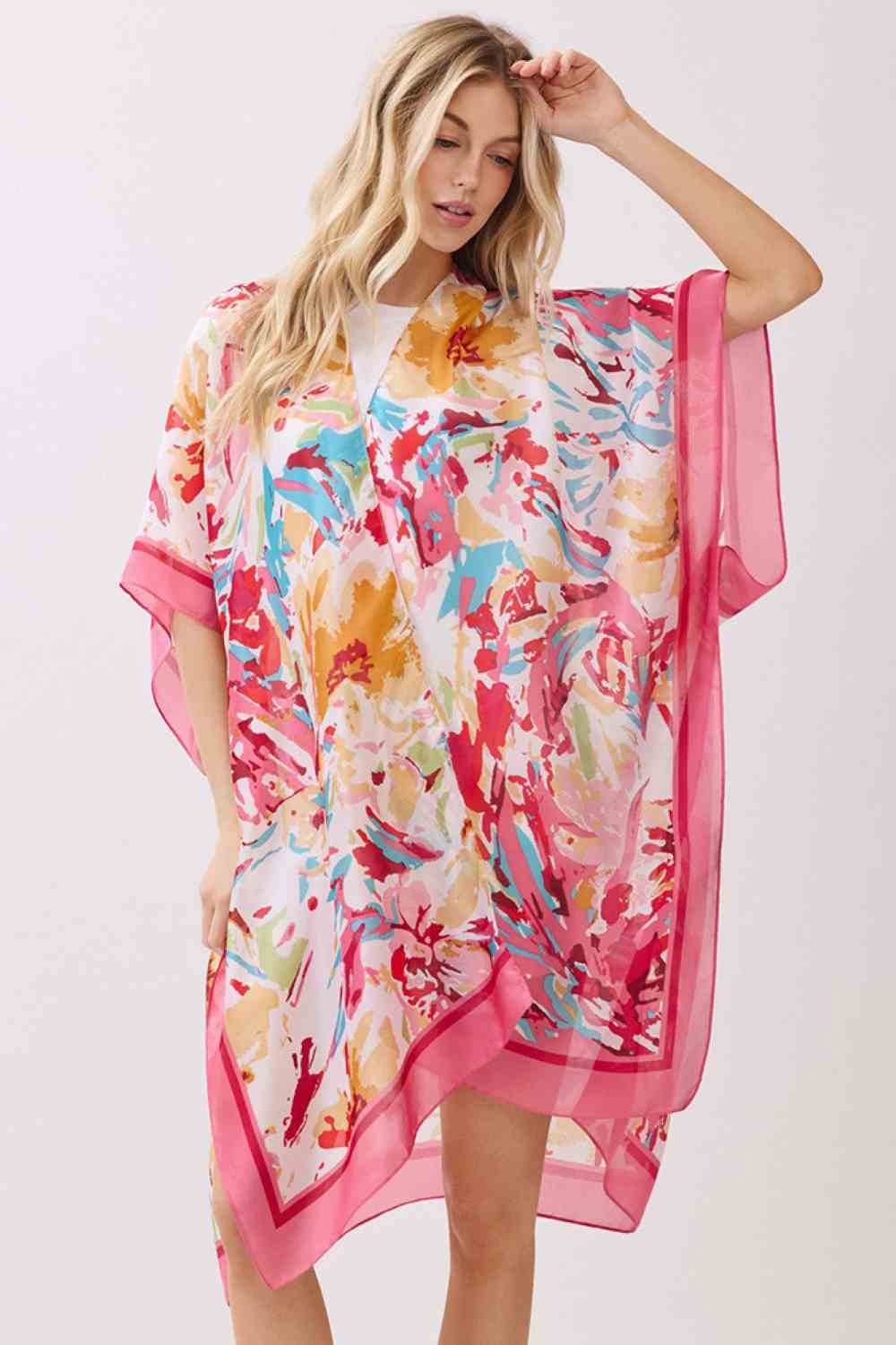 Pink Effortless elegance meets comfort in this abstract floral kimono cover-up. Crafted from 100% polyester with a luxuriously silky feel, it features a vibrant floral print accented by solid color edges for a polished look. Perfect for layering over swimwear, loungewear, or casual outfits, this versatile piece transitions seamlessly from beach to brunch. Generous 35" x 36" dimensions provide flattering coverage and easy movement. An essential wardrobe staple for any season.
